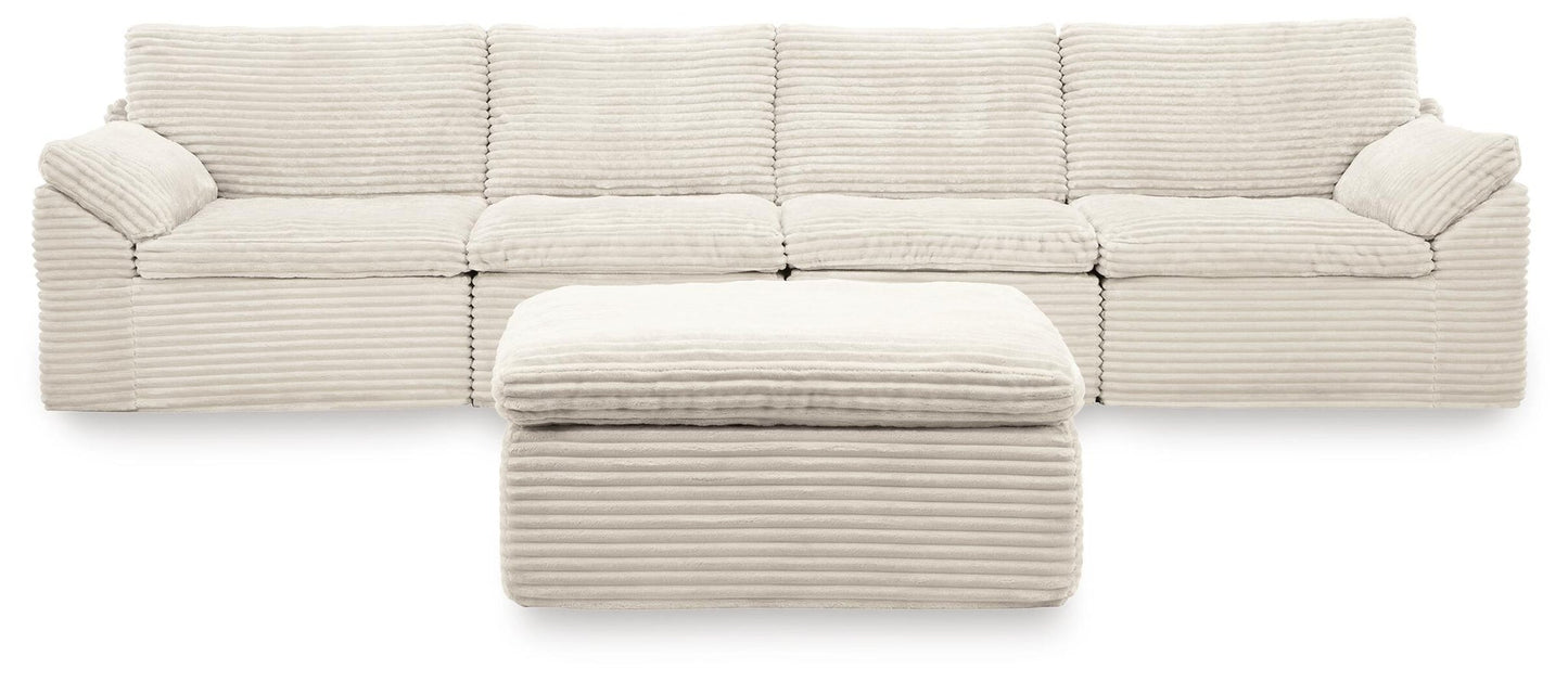 Ashley Express - Fannin 4-Piece Sectional with Ottoman